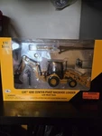 Norscot 55143 Caterpillar 420E Cp Backhoe Loader + Work Tools 1/50 Die-cast New. Fixed Price $43.00.