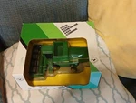 1/50 John Deere 4425 Combine Ertl. Fixed Price $46.95.