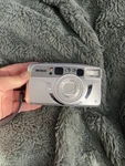 Argus M5700D 38-135MM Power Zoom Film Camera Silver Japan Lens With Case. Fixed Price $25.00.