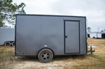 New 2026 V-nosed Enclosed Black Out Cargo Motorcycle Trailer W/ Ramp. Fixed Price $3395.00.