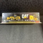 Peterbilt Model 389 With King Lowboy Trailer And Cat 950G Series Ii Wheel. Fixed Price $40.00.